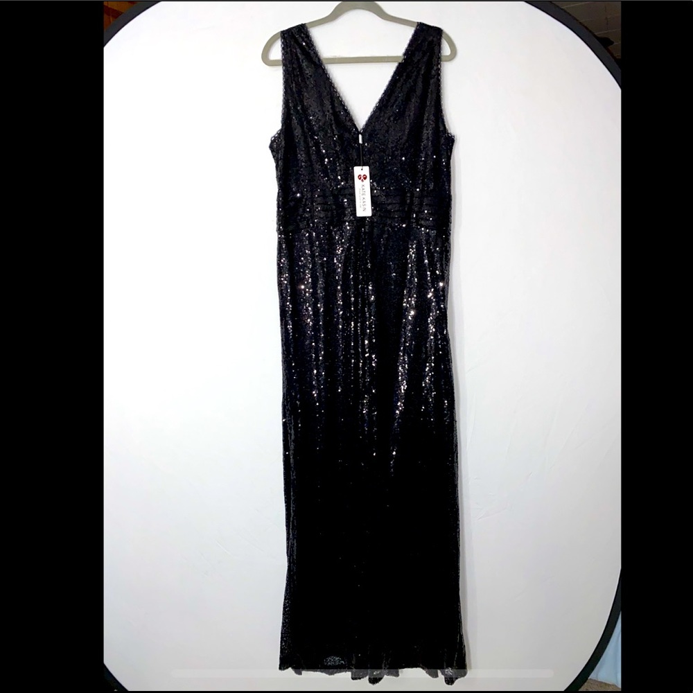 Black sequin floor length gown. V-neck front and back. Never worn.